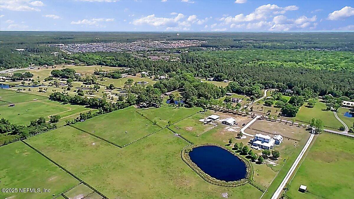 411 Ranch Road Ponte Vedra, FL 32081 - Photo 4 of 56 a view of a lake in front of residential houses with outdoor space