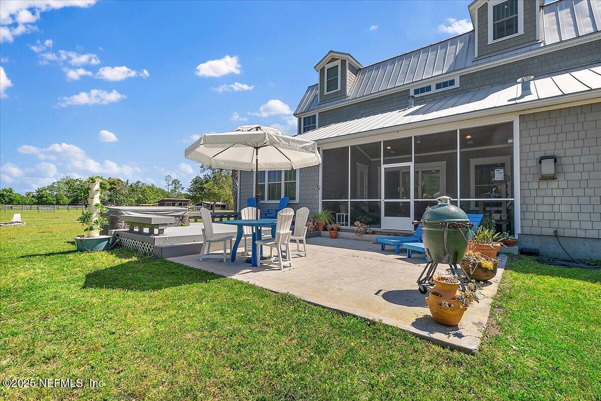 411 Ranch Road Ponte Vedra, FL 32081 - Photo 41 of 56 a view of a backyard with sitting area and garden