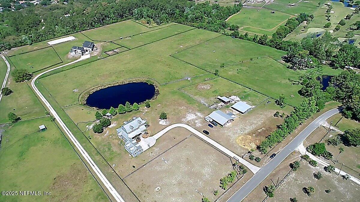 411 Ranch Road Ponte Vedra, FL 32081 - Photo 51 of 56 an aerial view of a house with a yard
