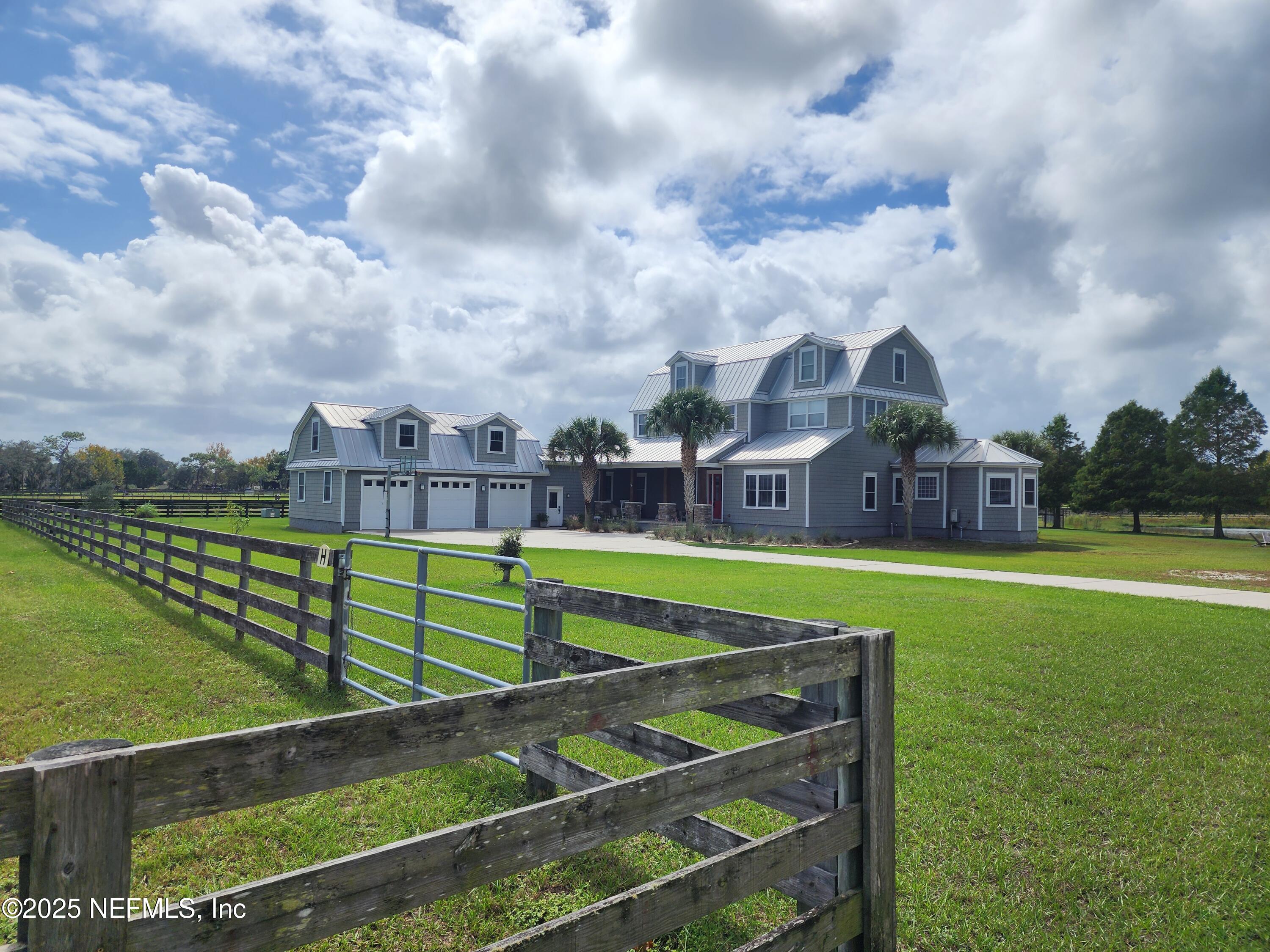 411 Ranch Road Ponte Vedra, FL 32081 - Photo 55 of 56 a view of a big house with a big yard and large trees