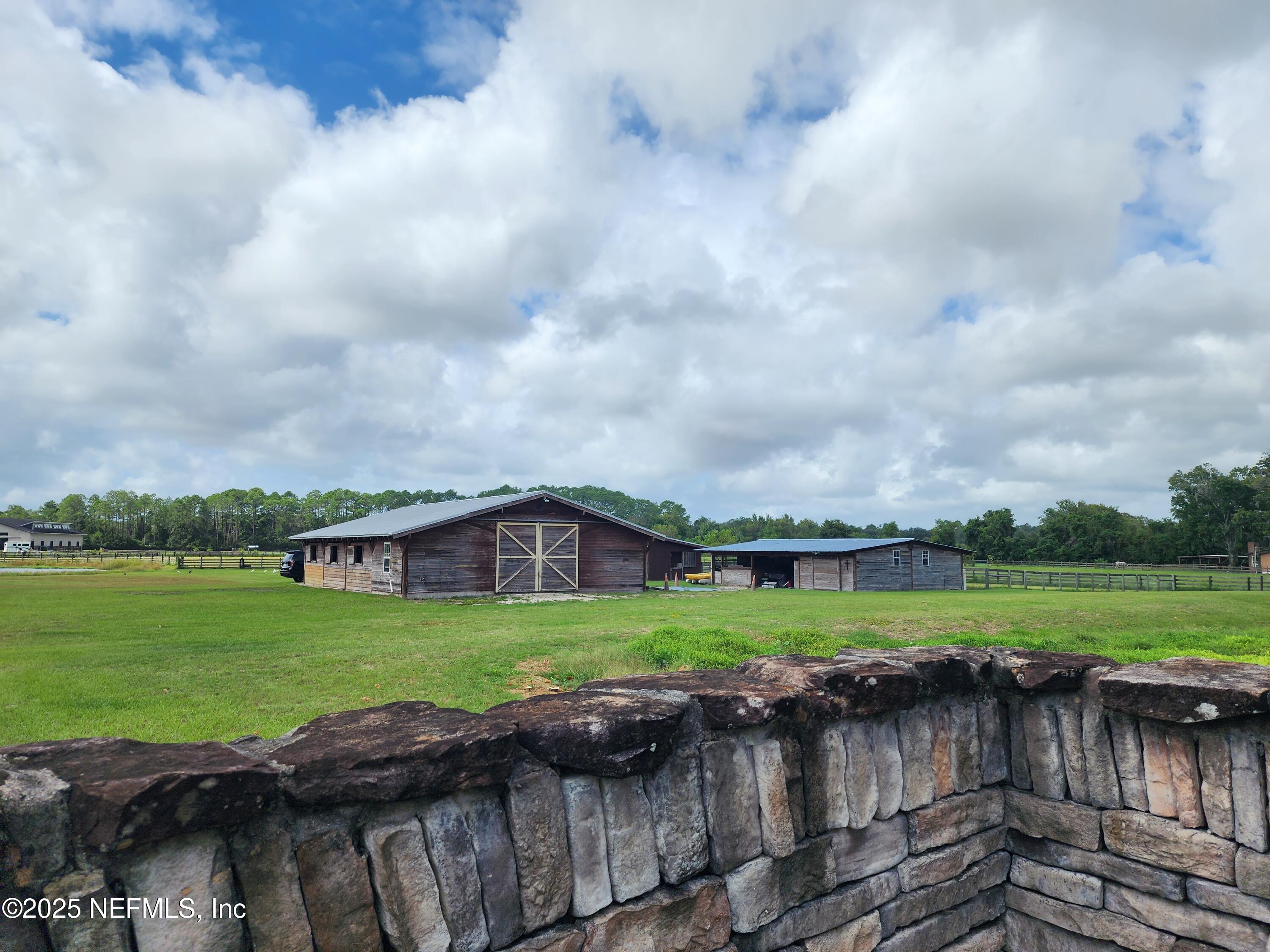 411 Ranch Road Ponte Vedra, FL 32081 - Photo 10 of 56 a view of a wooden deck and a yard