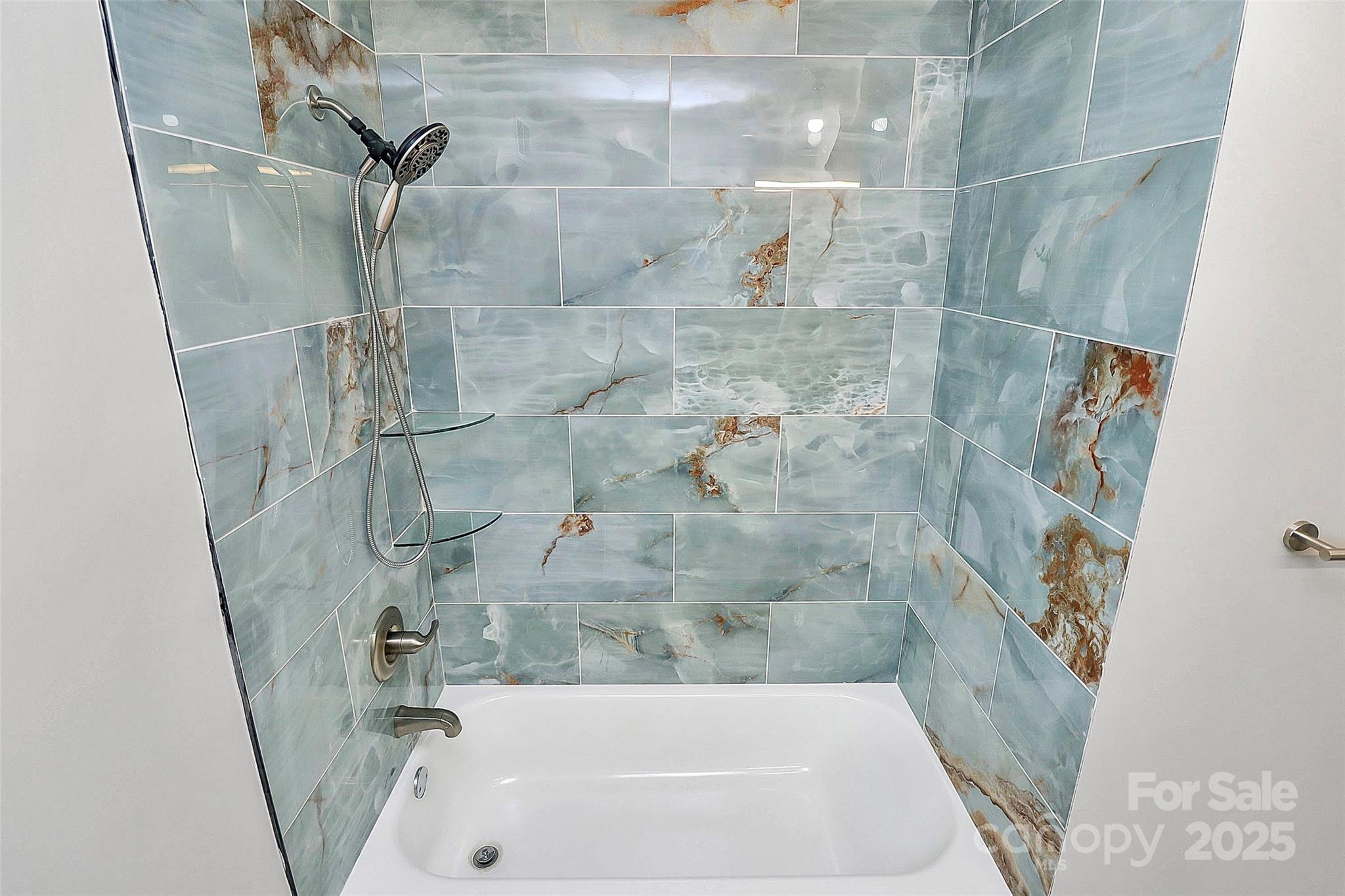 1300 Queens Road, Unit 409 Charlotte, NC 28207 - Photo 12 of 35 a bathroom with a bathtub