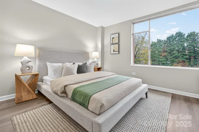 a bed room with a bed and a night lamp