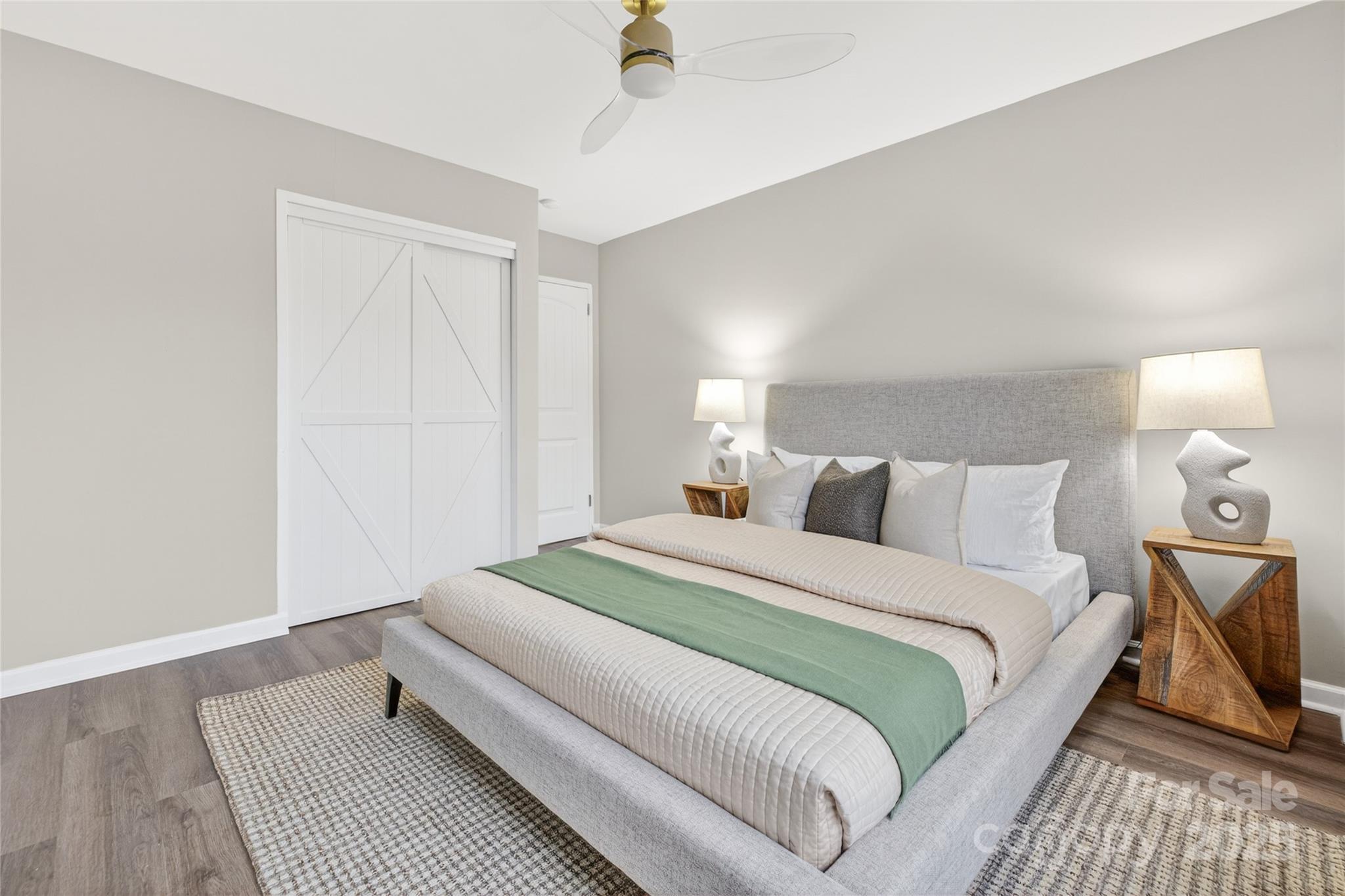 1300 Queens Road, Unit 409 Charlotte, NC 28207 - Photo 15 of 35 a bed room with a bed and a night lamp