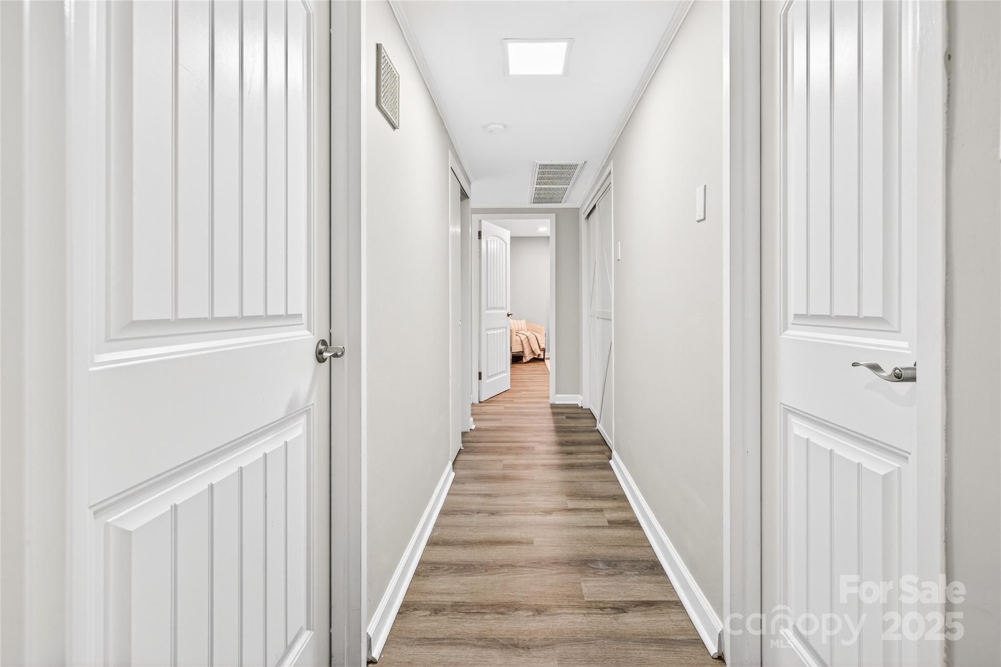 1300 Queens Road, Unit 409 Charlotte, NC 28207 - Photo 16 of 35 a view of a hallway with wooden floor and staircase