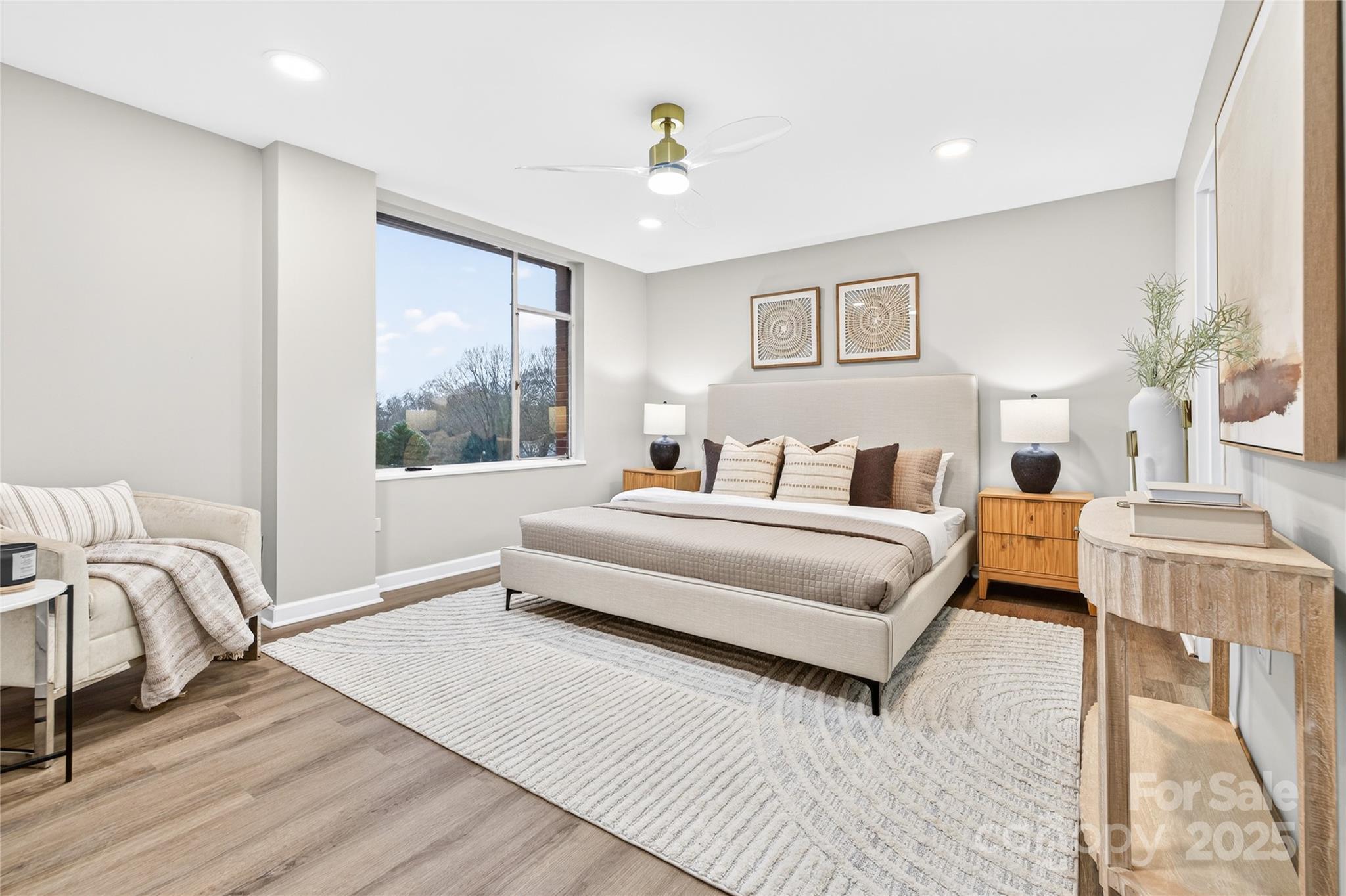 1300 Queens Road, Unit 409 Charlotte, NC 28207 - Photo 18 of 35 a bedroom with a bed and a large window