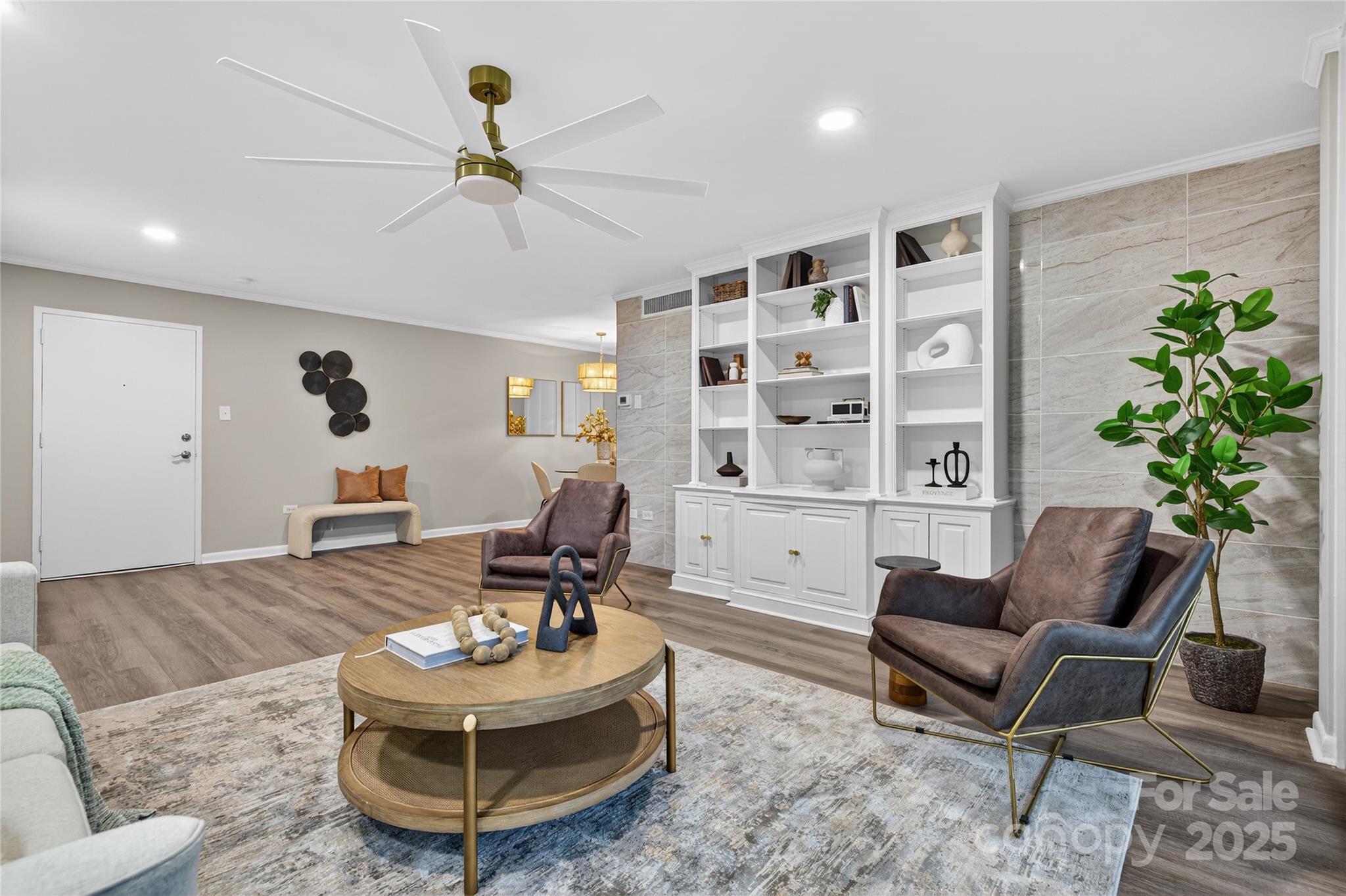 1300 Queens Road, Unit 409 Charlotte, NC 28207 - Photo 2 of 35 a living room with furniture and a chandelier