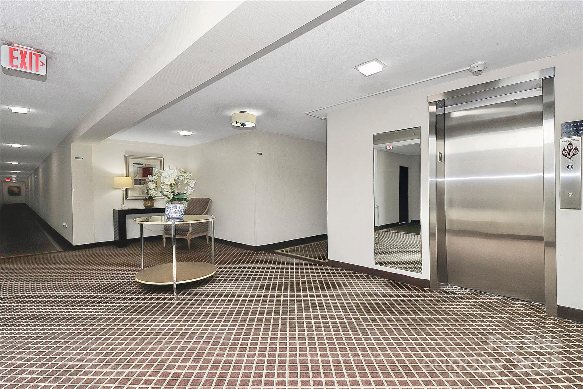 1300 Queens Road, Unit 409 Charlotte, NC 28207 - Photo 27 of 35 a view of a room with wooden floor table and chairs