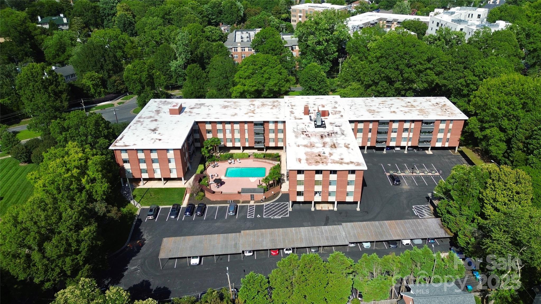 1300 Queens Road, Unit 409 Charlotte, NC 28207 - Photo 31 of 35 an aerial view of a house with outdoor space patio and outdoor seating
