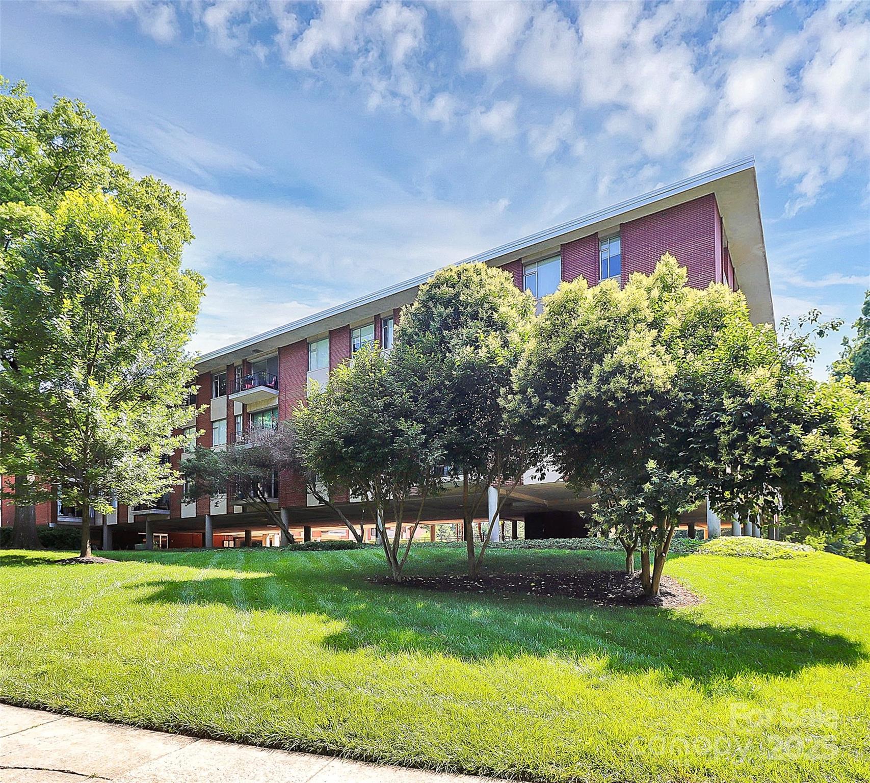 1300 Queens Road, Unit 409 Charlotte, NC 28207 - Photo 34 of 35 a front view of a house with garden