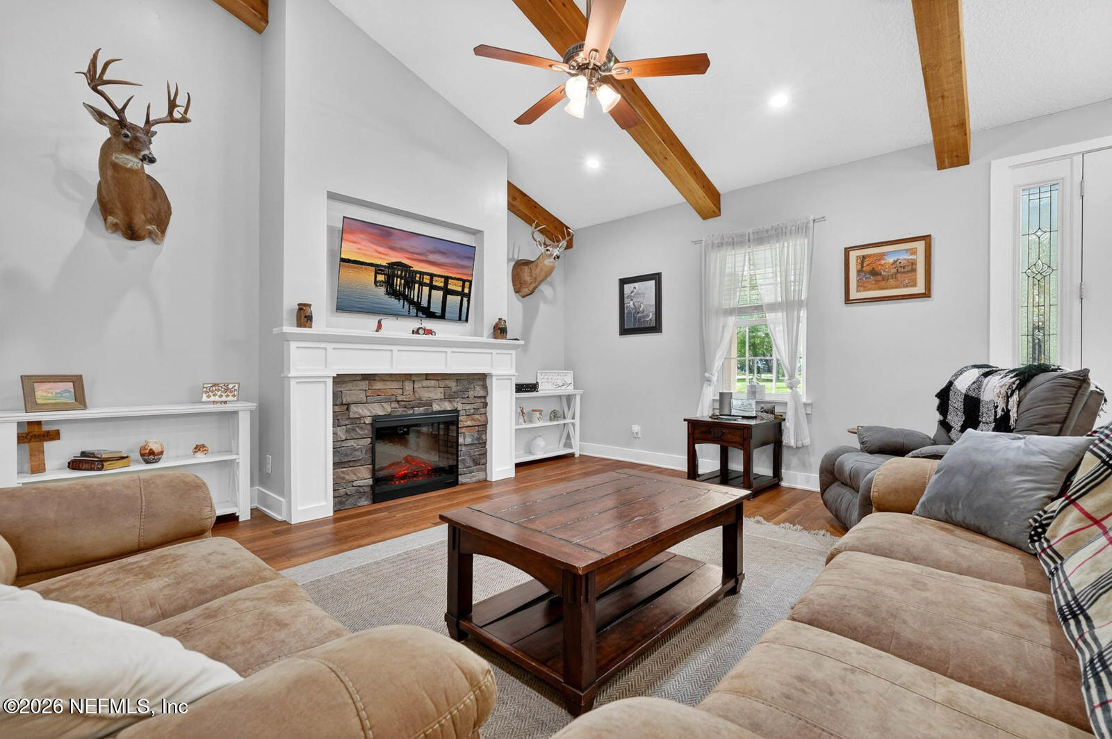 264 Peniel Church Road Palatka, FL 32177 - Photo 9 of 48 a living room with furniture and a fireplace