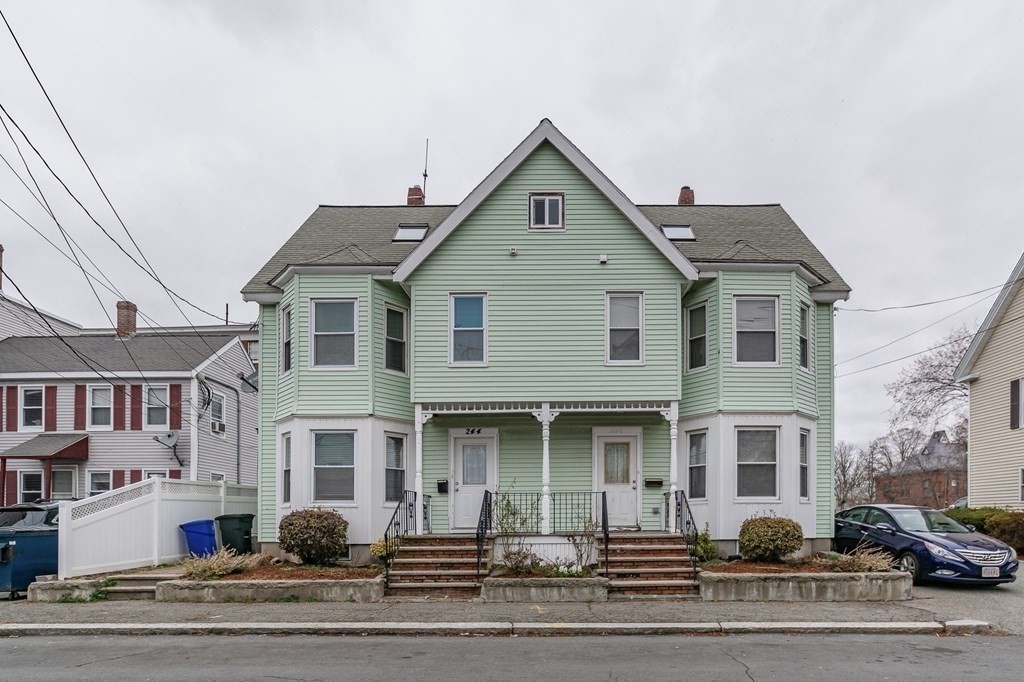 246 Haven Street, Unit 2 Reading, MA 01867 - Photo 1 of 23 a front view of a large white building