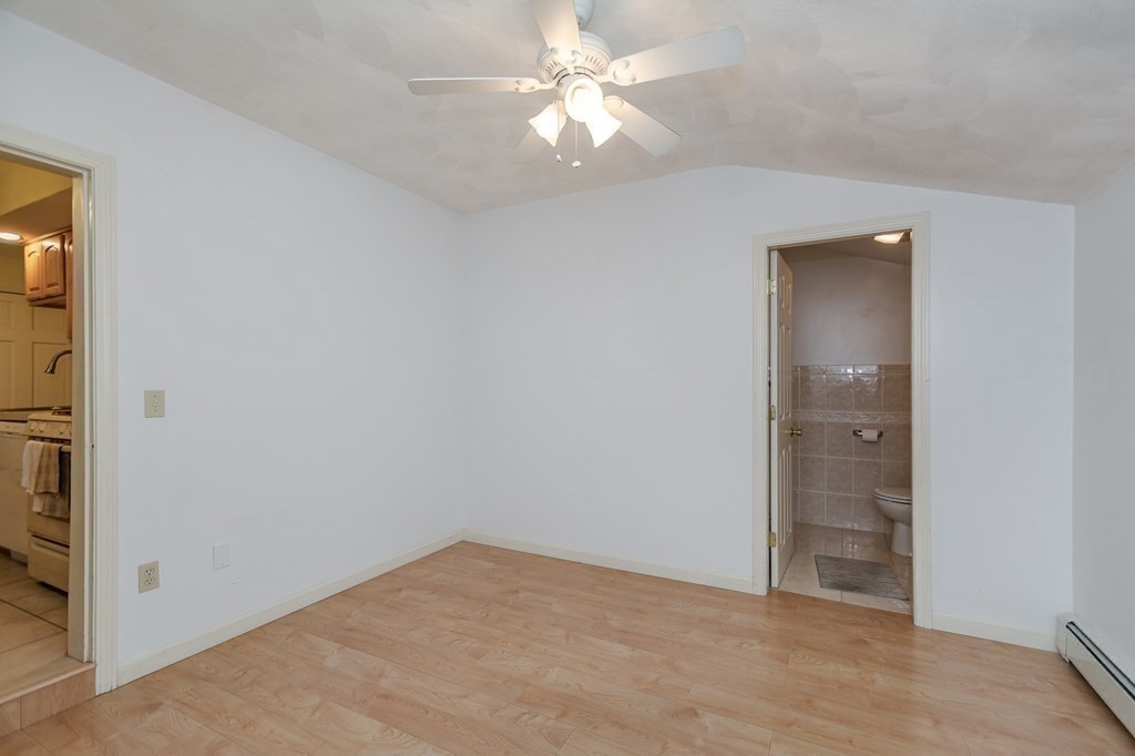 246 Haven Street, Unit 2 Reading, MA 01867 - Photo 12 of 23 wooden floor in an empty room