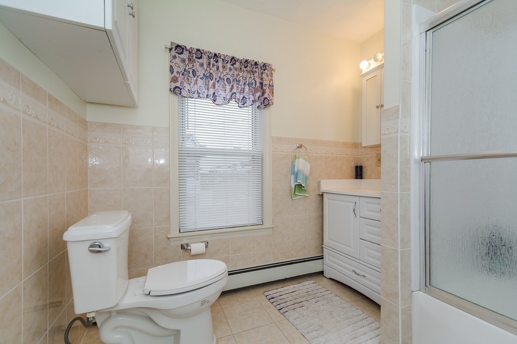 246 Haven Street, Unit 2 Reading, MA 01867 - Photo 19 of 23 a bathroom with a toilet sink and shower