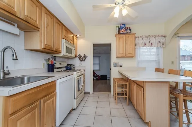 a kitchen with stainless steel appliances granite countertop a sink and cabinets