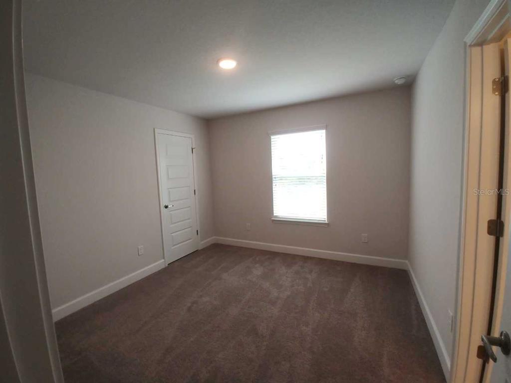 4380 Southwest 92nd Pl Road Ocala, FL 34476 - Photo 35 of 57 an empty room with a window