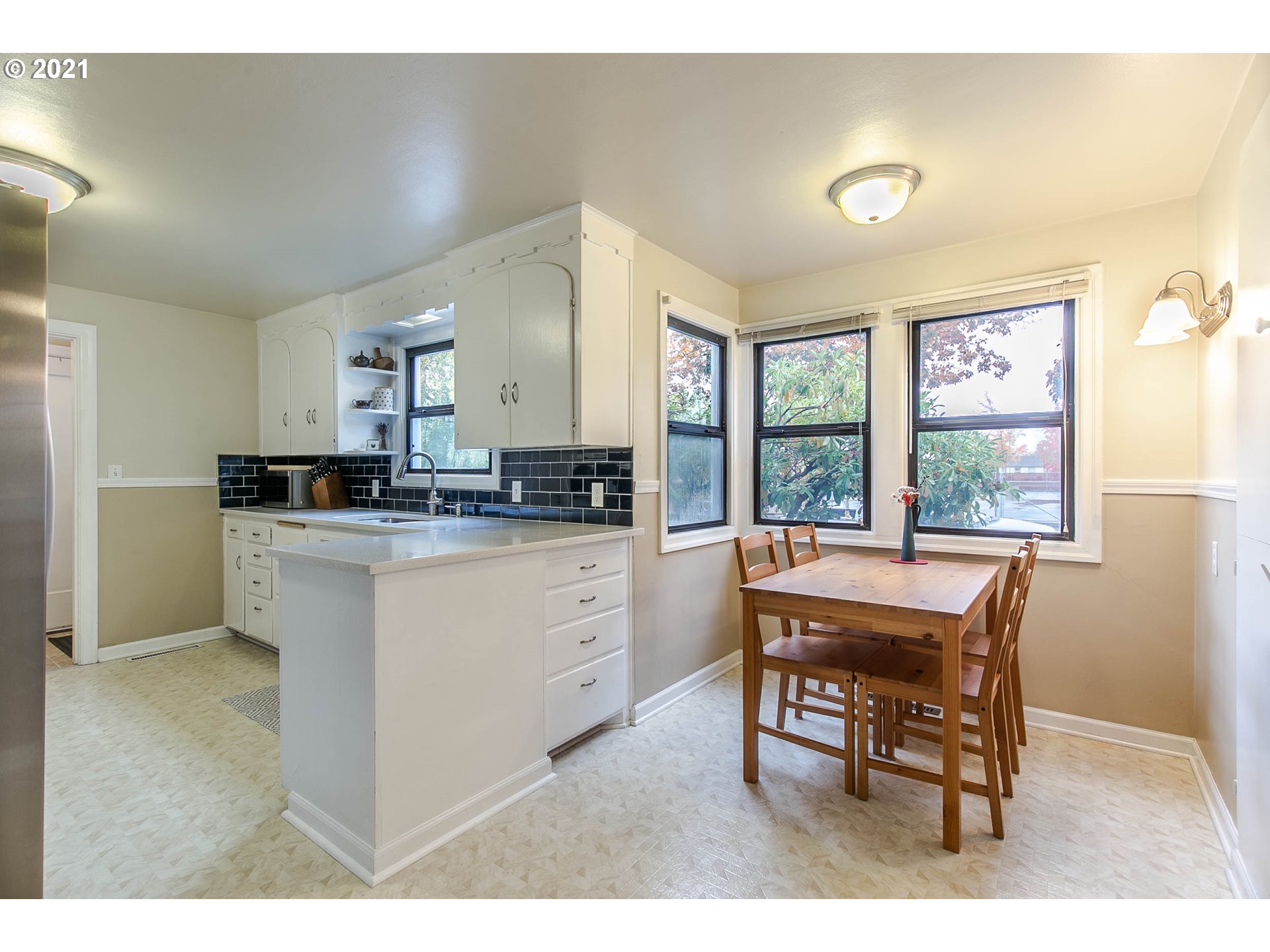 249 8th Street Springfield, OR 97477 - Photo 12 of 32 a kitchen that has a cabinets counter space and appliances