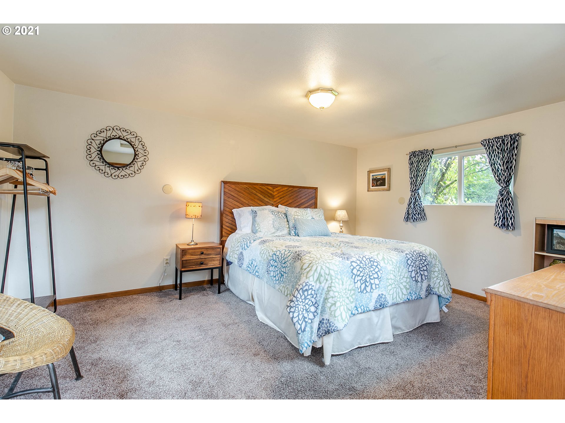 249 8th Street Springfield, OR 97477 - Photo 29 of 32 a spacious bedroom with a bed and a window