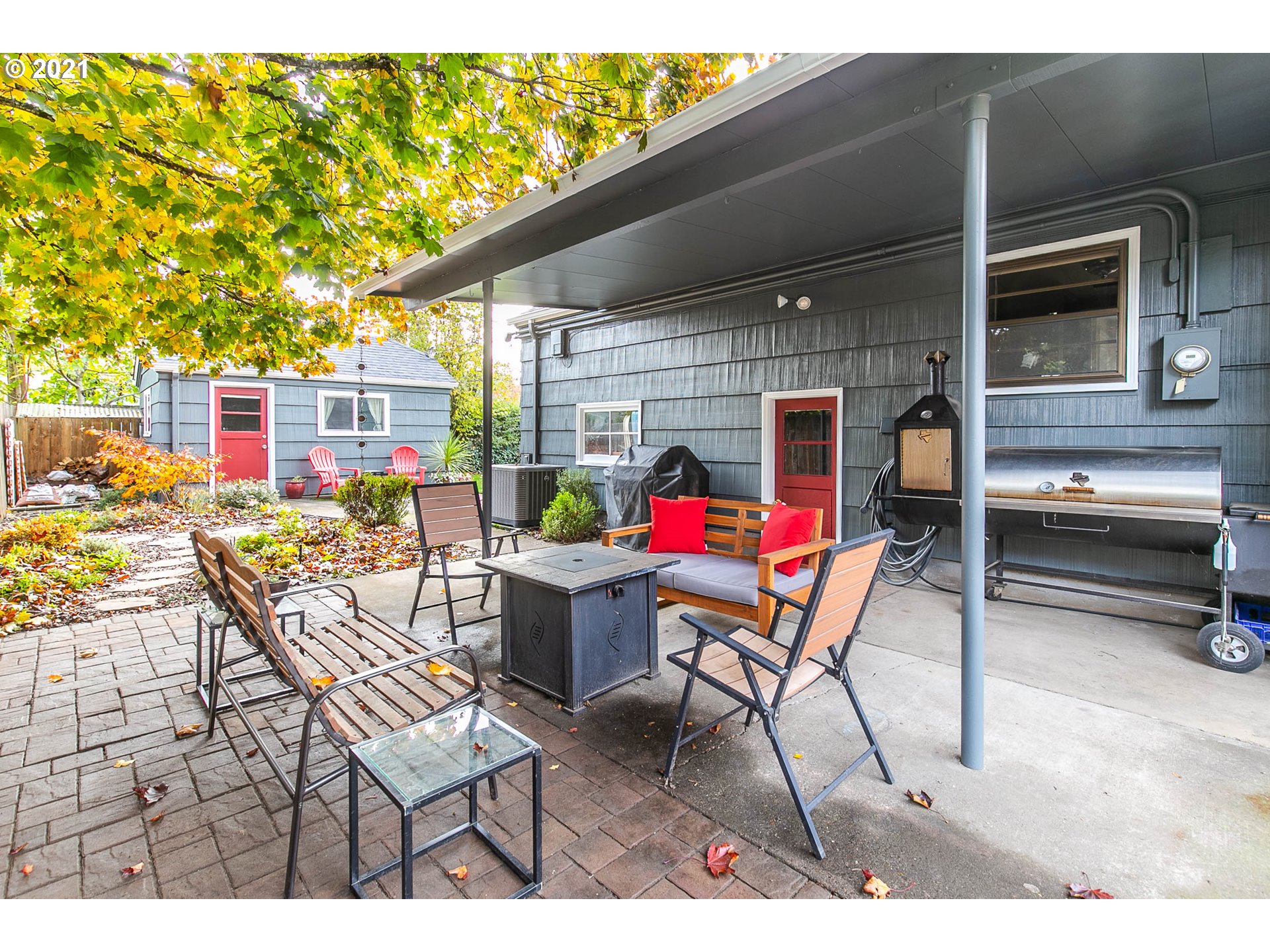 249 8th Street Springfield, OR 97477 - Photo 32 of 32 a view of a patio with a dining table and chairs with wooden floor