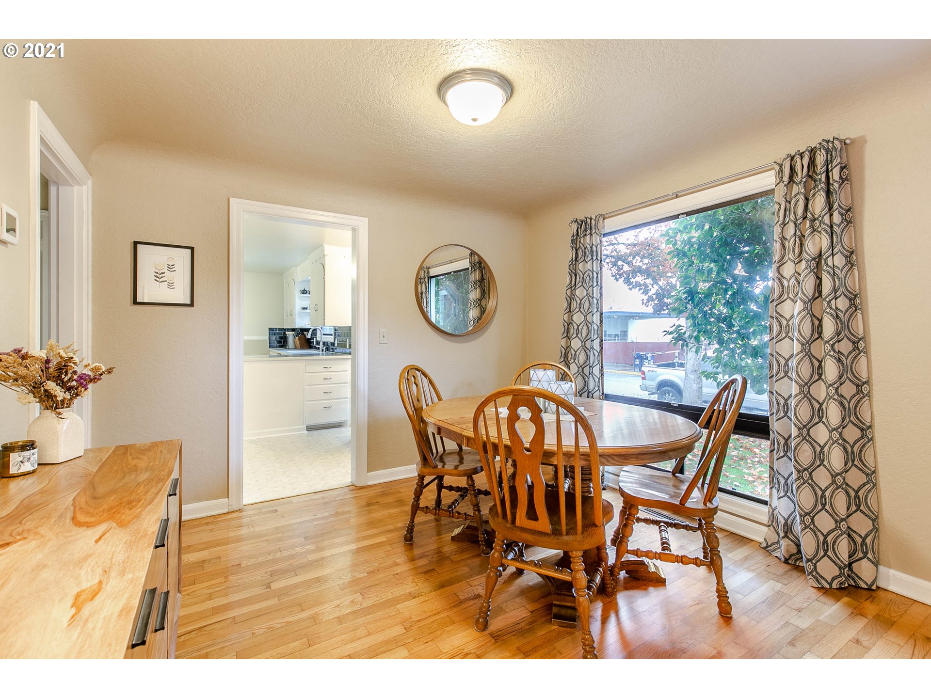 249 8th Street Springfield, OR 97477 - Photo 9 of 32 a view of a dining room with furniture and a large window