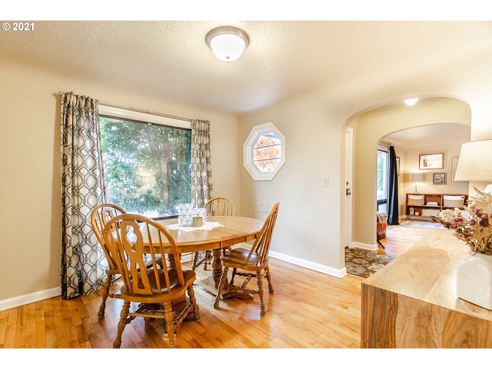249 8th Street Springfield, OR 97477 - Photo 10 of 32 a view of a dining room with furniture and a window