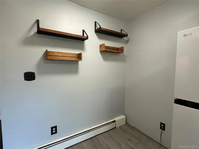 an empty room with wooden floor