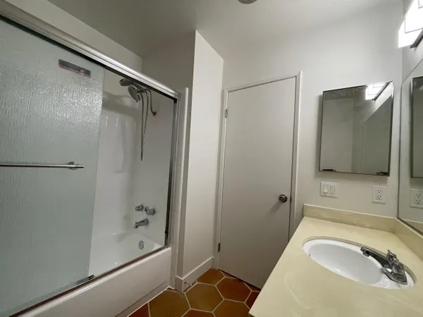 a bathroom with a sink and a mirror