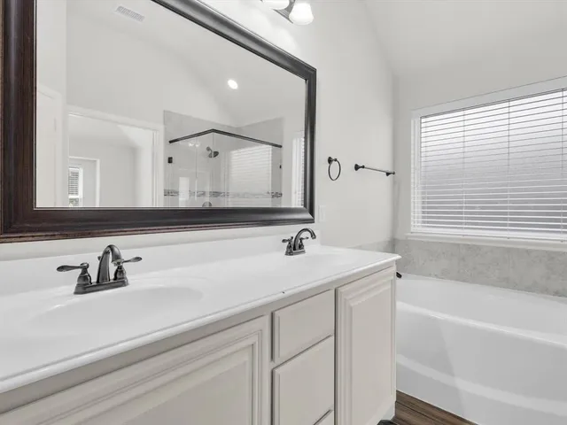 a bathroom with a sink and a bathtub