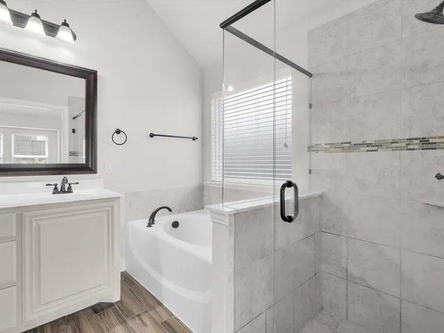 a bathroom with a bathtub and a sink