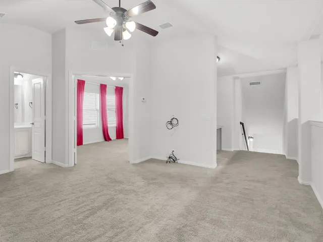 a view of empty room with fan