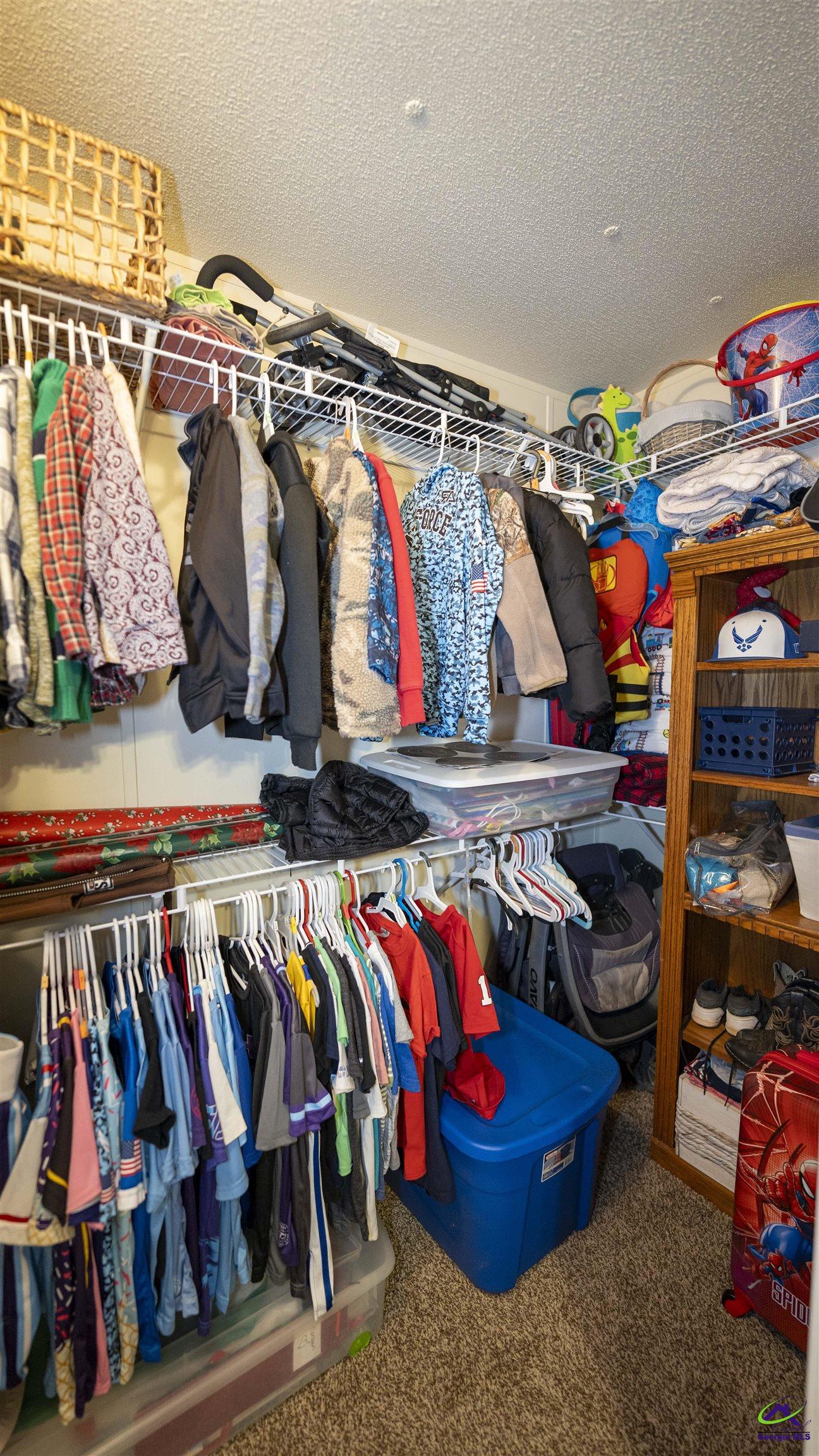 500 Old Milledgeville Road Cochran, GA 31014 - Photo 44 of 48 a view of walk in closet with clothes and shoes