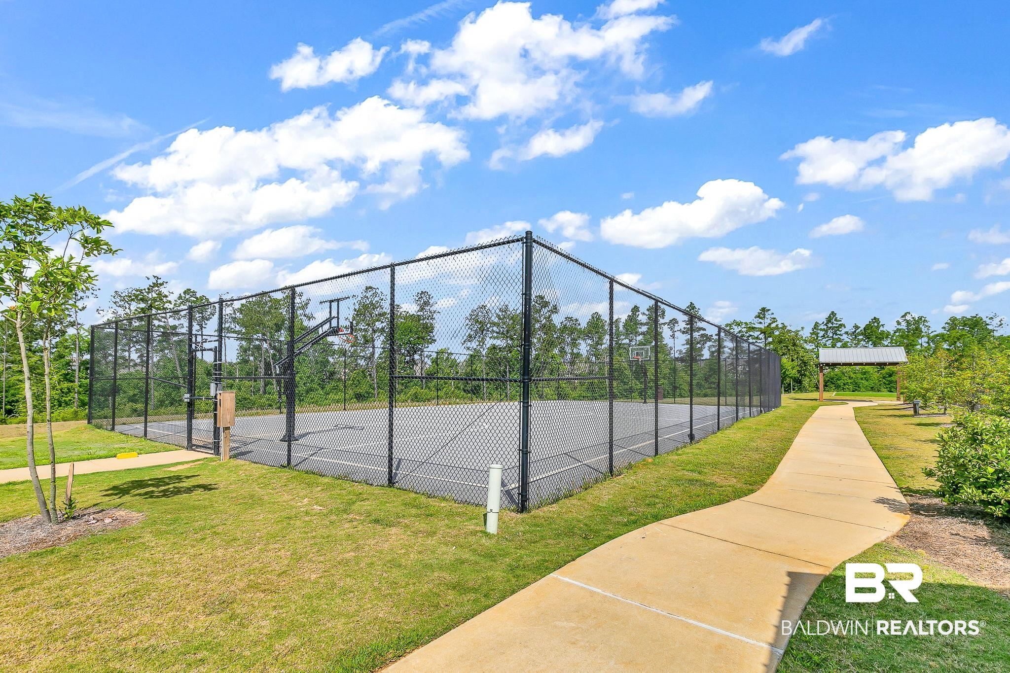 31402 Hoot Owl Road Daphne, AL 36527 - Photo 38 of 43 View of tennis court with a yard