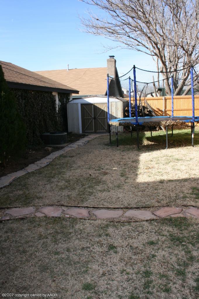 2702 Shadow Court Amarillo, TX 79110 - Photo 21 of 23 a view of a house with large trees