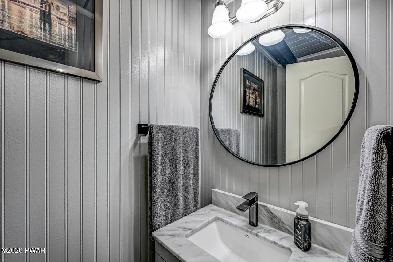 103 Forest Drive Hawley, PA 18428 - Photo 31 of 85 a bathroom with a sink and a mirror