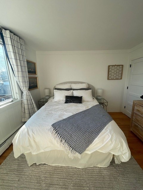 72 Front Street, Unit 4 Marblehead, MA 01945 - Photo 7 of 16 a bedroom with a bed and wooden floor