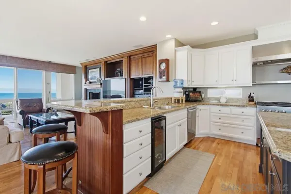 a view of a kitchen and dining room