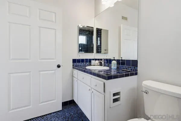 a view of an empty room with a bathroom