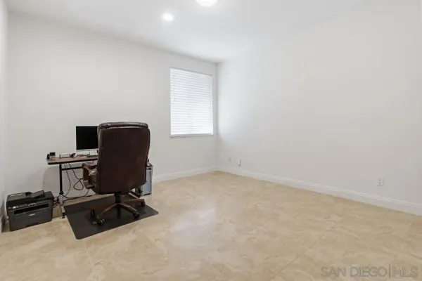 a view of a hallway with a wooden cabinets