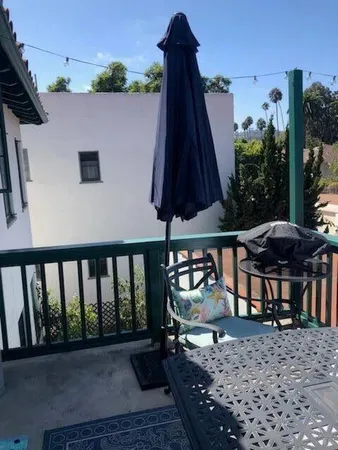 a view of a house with backyard and porch