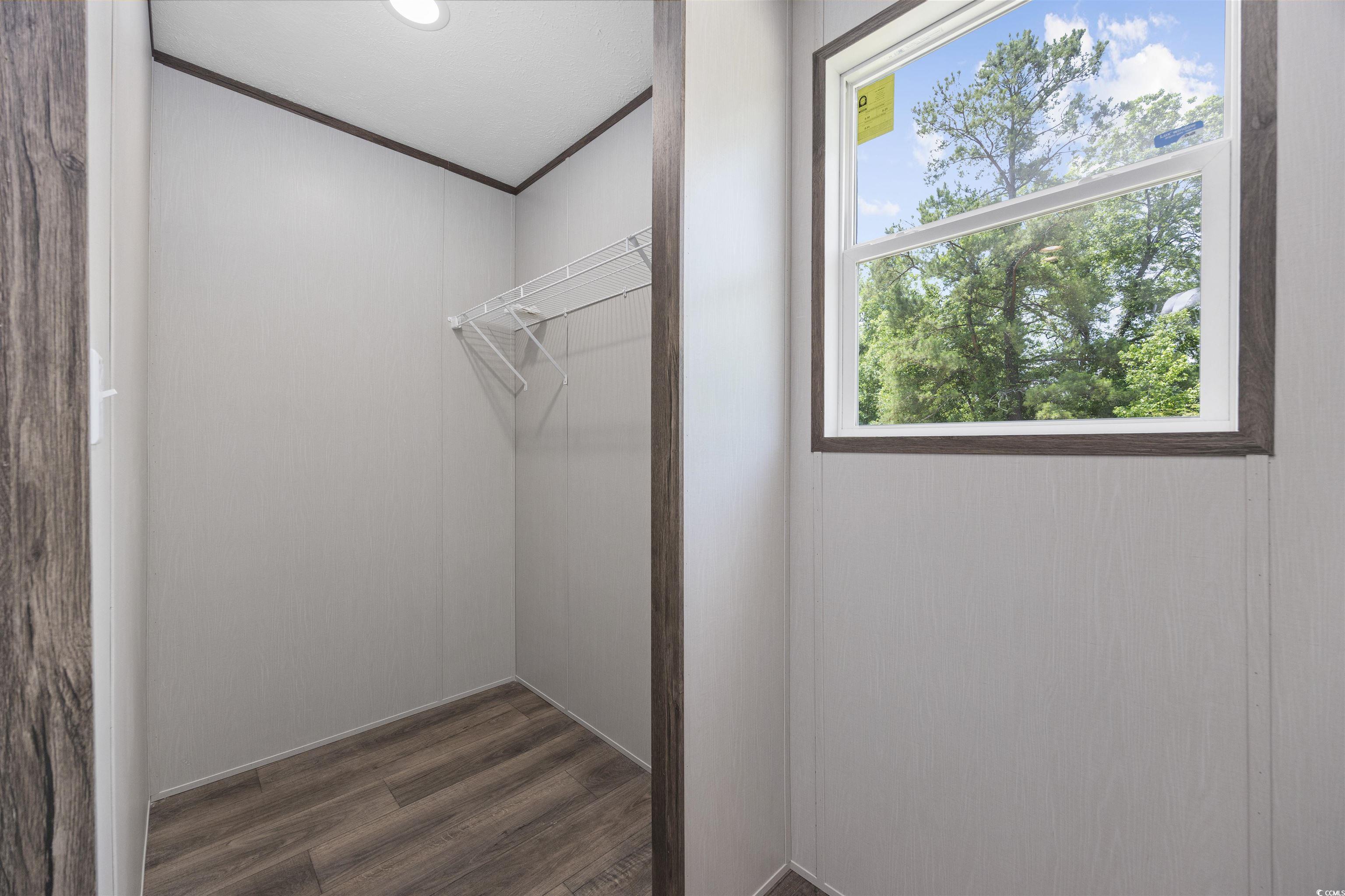 1315 Rabbit Lane Conway, SC 29526 - Photo 18 of 27 Spacious closet with dark wood-type flooring