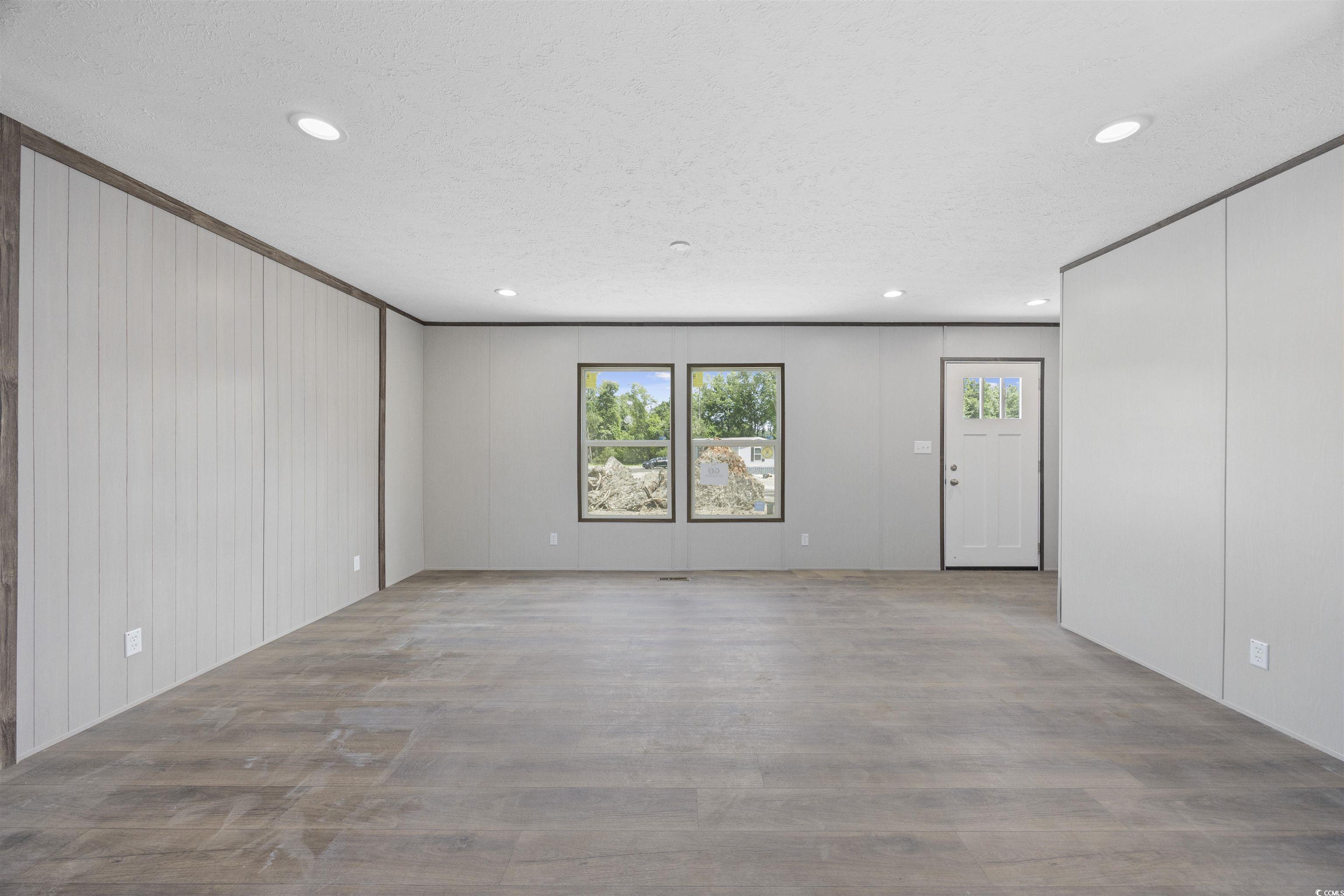 1315 Rabbit Lane Conway, SC 29526 - Photo 5 of 27 Unfurnished living room with recessed lighting, wood finished floors, a textured ceiling, and a decorative wall