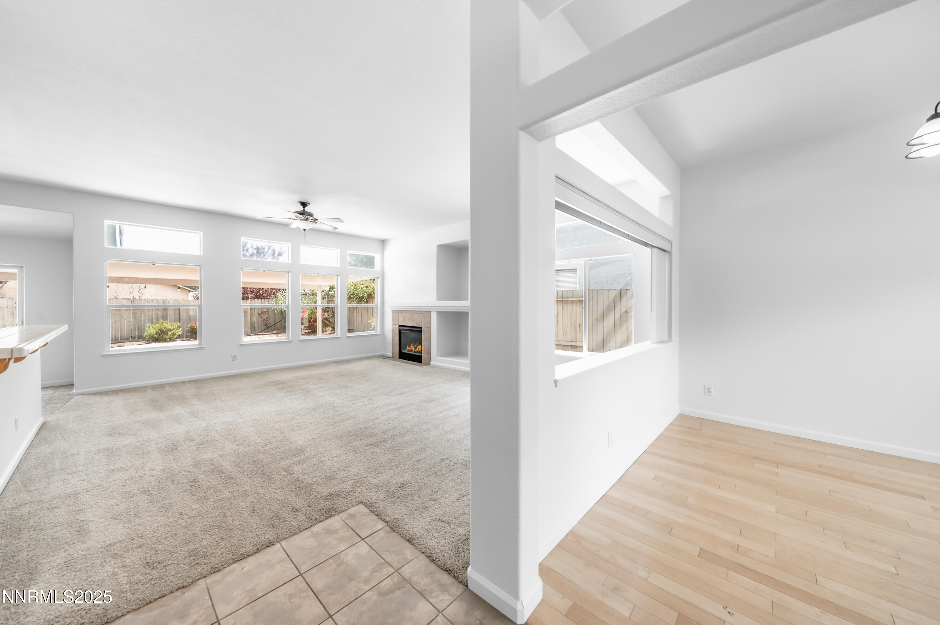 1260 Edgehill Court, Unit ARBOR Reno, NV 89521 - Photo 11 of 50 a view of an empty room with wooden floor and a window