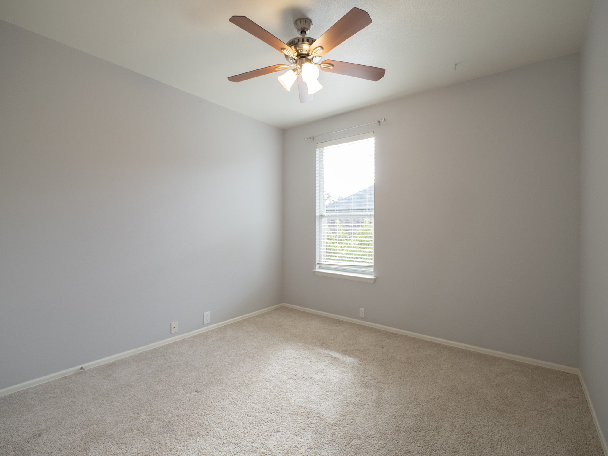 572 Big Meadow Road Austin, TX 78737 - Photo 19 of 32 An airy bedroom provides ample space and neutral tones, awaiting your personal touch.