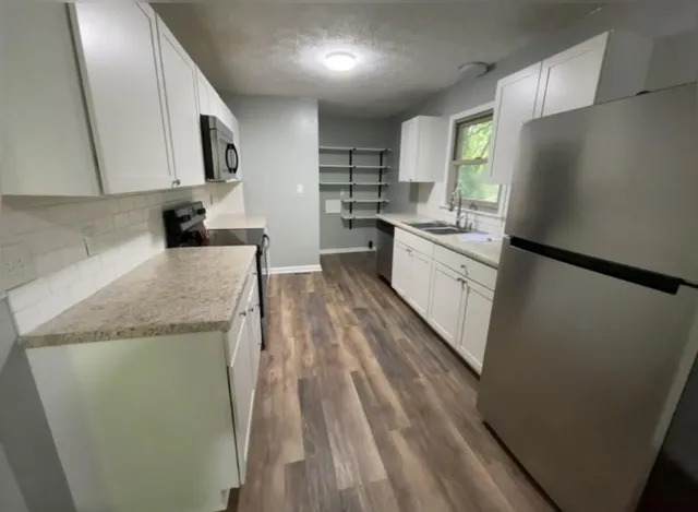 a front view of a house with a fence