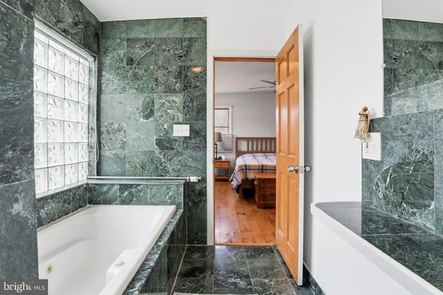 a bathroom with a bathtub and a sink