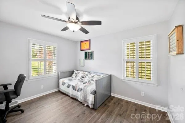 a bedroom with bed and a window