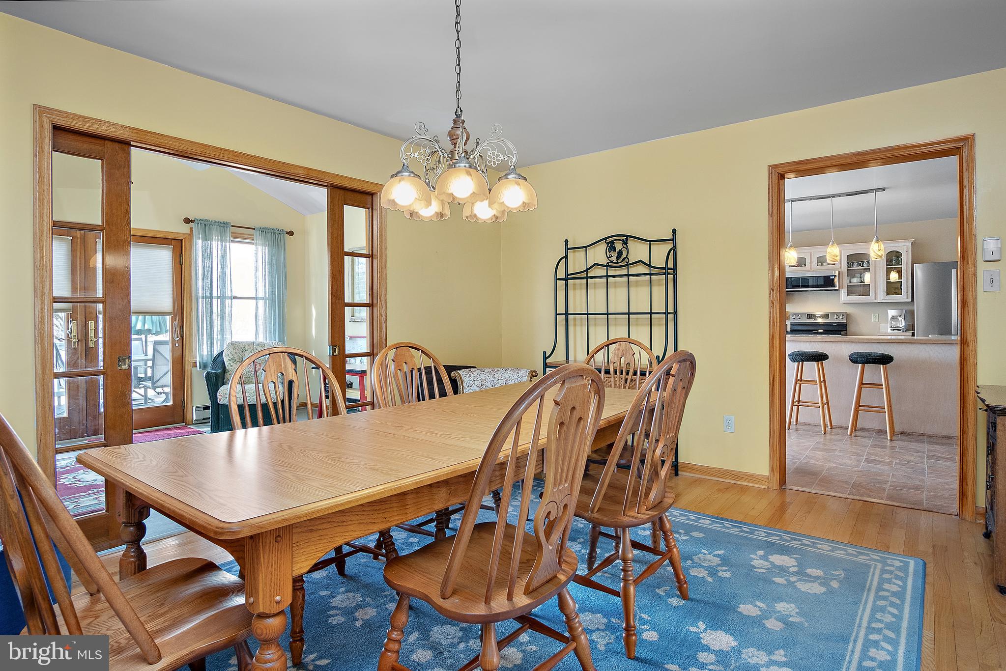 13810 Franks Run Road Smithsburg, MD 21783 - Photo 11 of 72 a view of a dining room with furniture wooden floor and chandelier