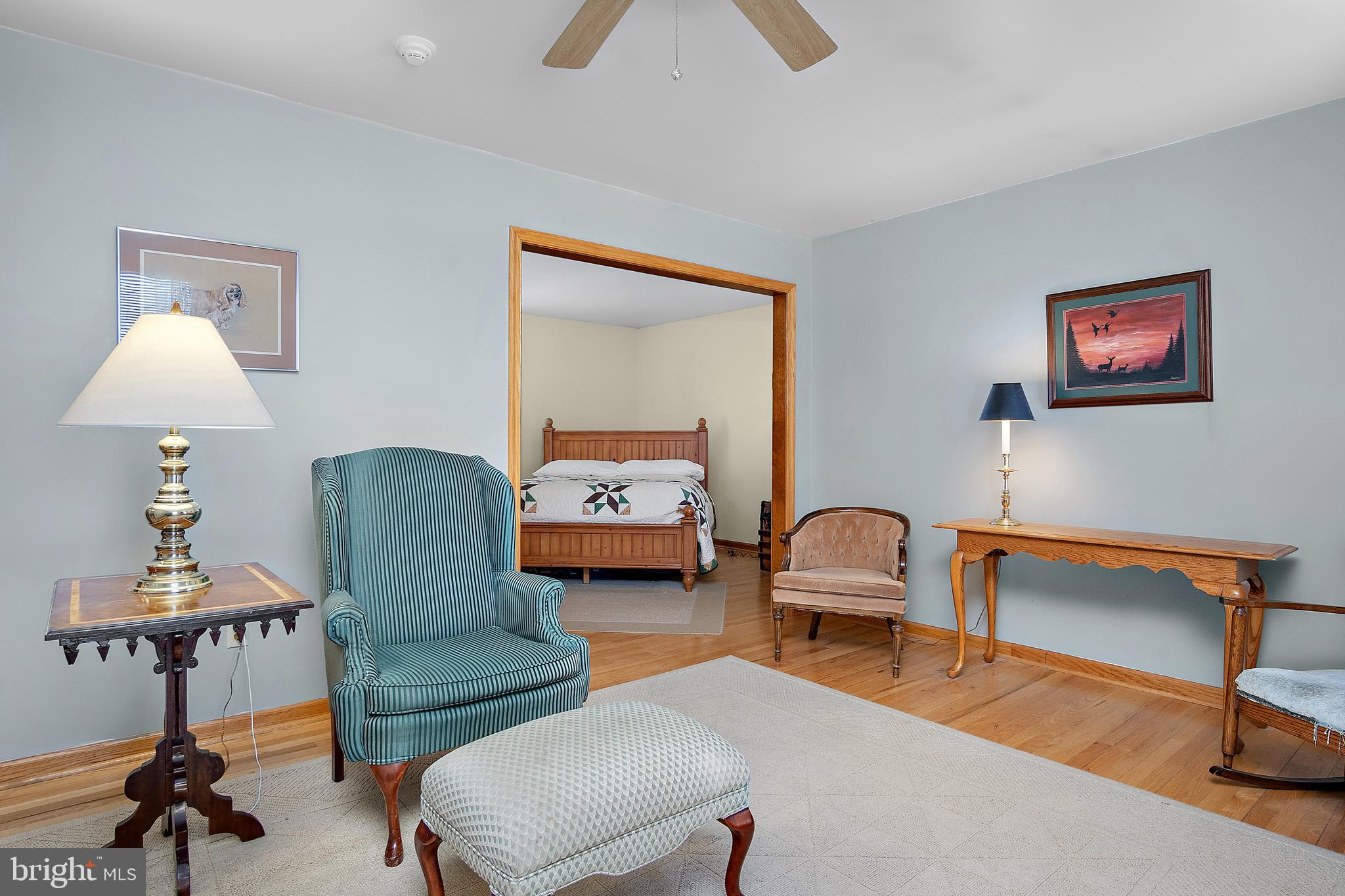 13810 Franks Run Road Smithsburg, MD 21783 - Photo 23 of 72 a living room with furniture and a lamp