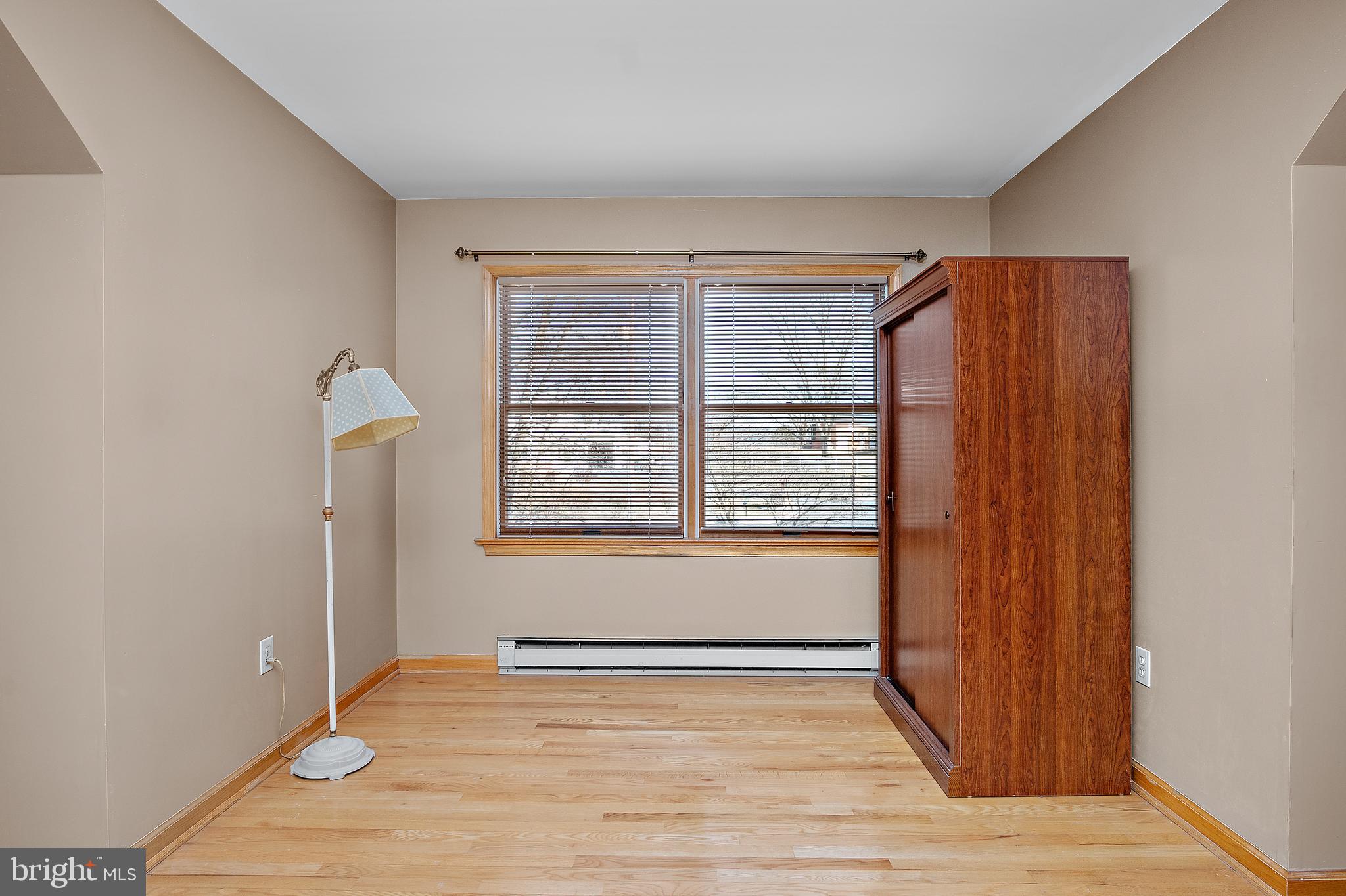 13810 Franks Run Road Smithsburg, MD 21783 - Photo 34 of 72 a view of an empty room with wooden floor and a window