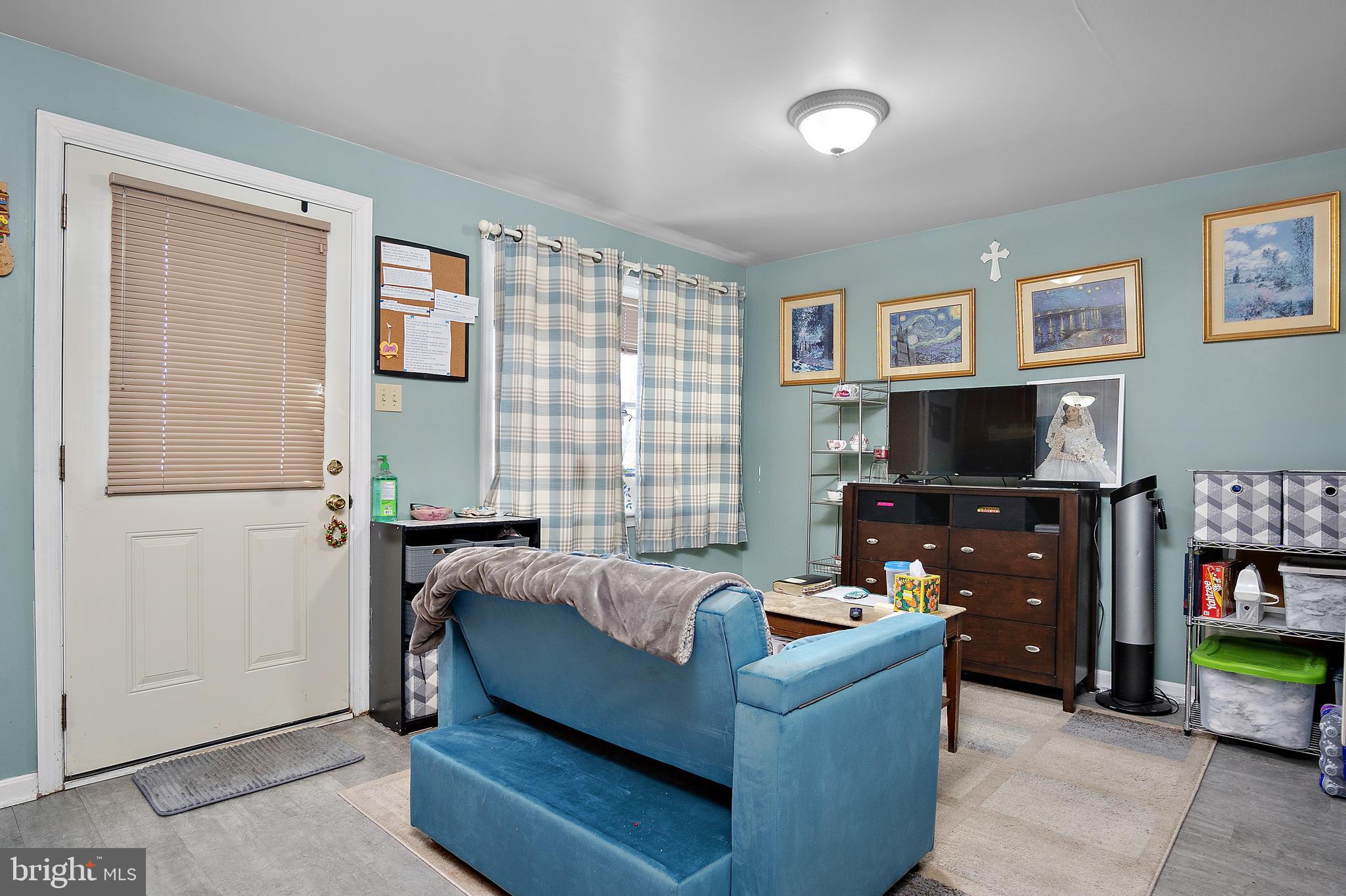 13810 Franks Run Road Smithsburg, MD 21783 - Photo 45 of 72 a living room with furniture and a flat screen tv